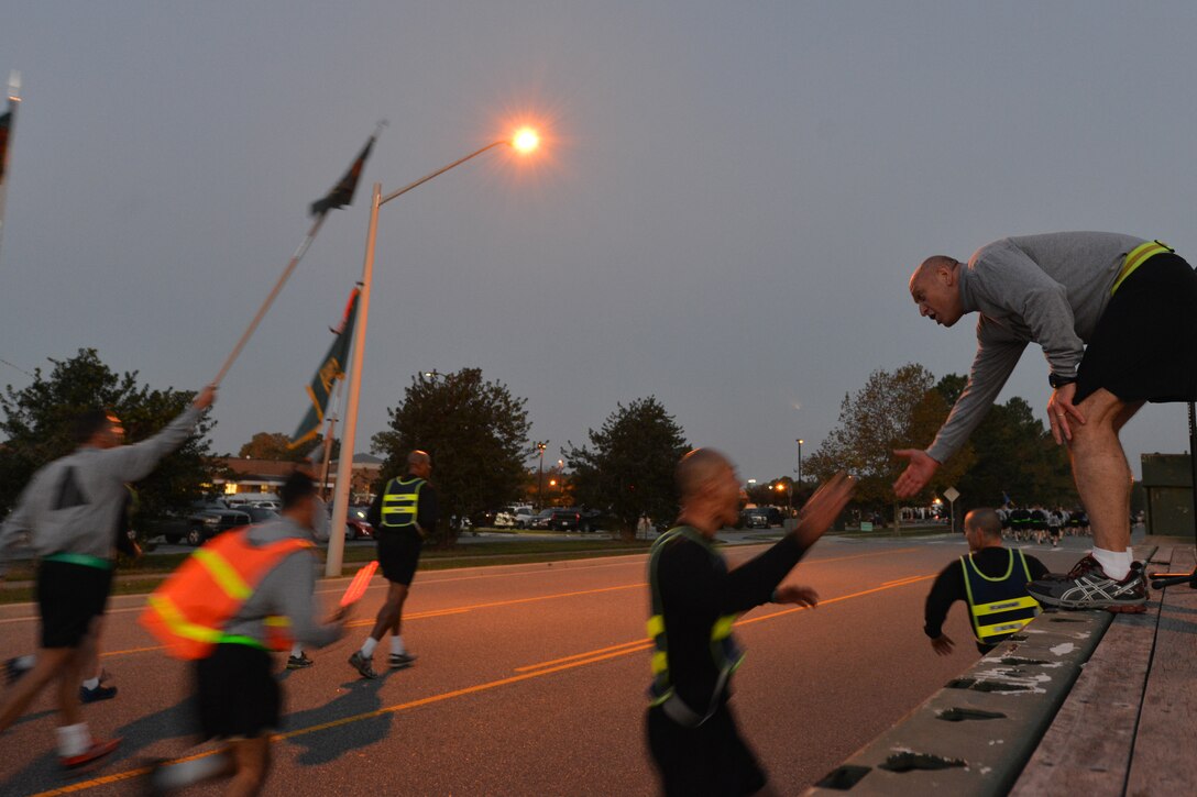 U.S. Army Maj. Gen. Anthony C. Funkhouser, Center for Initial Military Training commander, supports Domestic Violence Awareness Month run participants at Fort Eustis, Va., Oct. 23, 2015.  The event highlighted this year’s awareness theme, "It starts with respect ... Live core values to keep your love healthy and strong.” (U.S. Air Force photo by Staff Sgt. Natasha Stannard/Released)