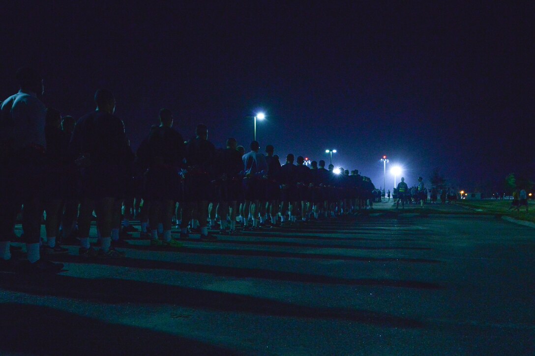 U.S. Service members prepare for a Domestic Violence Awareness Month run at Fort Eustis, Va., Oct. 23, 2015. The 2.2-mile run, along with other events, was conducted to bring awareness to the Joint Base Langley-Eustis, Va., populace as domestic violence affects the entire nation. (U.S. Air Force photo by Staff  Sgt. Natasha Stannard/Released)