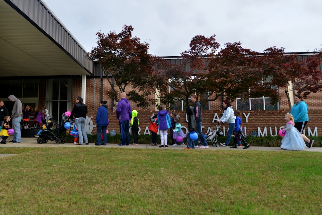Families line up for Night at the Transportation Museum at Fort Eustis, Va., Oct. 26, 2015. The event provided families a safe and educational trick-or-treating occasion, which featured historical enactments by actors in nativity scenes. (U.S. Air Force photo by Staff Sgt. Natasha Stannard/Released)