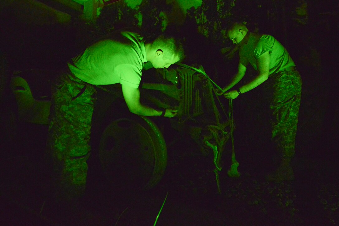 U.S. Army Advanced Individual Training students decorate the U.S. Army Transportation Museum in preparation for Night at the Transportation Museum at Fort Eustis, Va., Oct. 26, 2015. The students and museum staff worked together to set up for the annual event, which featured displays brought to life by actors. (U.S. Air Force photo by Staff Sgt. Natasha Stannard/Released)