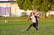 Joshua Orick, 436th Logistics Readiness Squadron quarterback, runs with the football towards the end zone Oct. 26, 2015, on Dover Air Force Base, Del. The 436th LRS played 436th Security Forces Squadron in an intramural flag football game. (U.S. Air Force photo/Roland Balik)