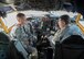 Col. Brain McDaniel, 92nd Air Refueling Wing commander, and Col. Mathew Fritz, 92nd ARW, vice commander, talk about the KC-135 Stratotankers new Block 45 upgrade and how it is beneficial to the KC-135’s utilization Oct. 23, 2015, at Fairchild Air Force Base, Wash.  Different aspects of the Block 45 upgrade include a new radio altimeter, a new auto pilot, a new digital liquid crystal display and several other small changes to the interface. (U.S. Air Force photo/Airman 1st Class Sean Campbell)