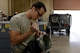 Senior Airman Joshua Heninger, 56th Equipment Maintenance Squadron aerospace ground equipment journeyman, works on replacing an air duct at Luke Air Force Base, Arizona, Oct. 27, 2015. The air duct goes to a 270 volt DC air conditioner hybrid for the F-35. (U.S. Air Force photo by Senior Airman James Hensley)