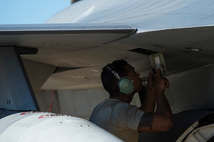 BEJA AIR BASE, Portugal – U.S. Air Force Staff Sgt. Christopher Pridgen, 52nd Aircraft Maintenance Squadron crew chief, conducts a pre-flight check on an F-16 Fighting Falcon fighter aircraft, assigned to the 480th Fighter Squadron at Spangdahlem Air Base, Germany, before it participates in Trident Juncture 2015 at Beja Air Base, Portugal, Oct. 22, 2015. More than 100 Airmen assigned to the 52nd Maintenance Group deployed to Portugal in support of Trident Juncture 2015, exercise conducted in the past 20 years. (U.S. Air Force photo by Airman 1st Class Luke Kitterman/Released)