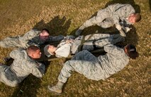 The 5th Medical Group Global Strike Challenge medic team crawls with a litter during a GSC competition at Minot Air Force Base, N.D., Oct. 19, 2015. The 5th MDG had six teams that competed against each other, this was the first year that the 5th MDG participated in GSC. (U.S. Air Force photo/Airman 1st Class Sahara L. Fales)