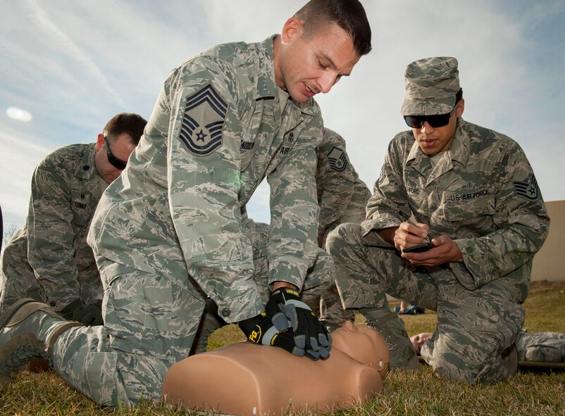 Chief Master Sgt. Johnny Randolph, 5th Medical Group Global Strike Challenge exec team member, performs CPR on a dummy during a Global Strike Challenge competition at Minot Air Force Base, N.D., Oct. 19, 2015. The 5th MDG had six teams that competed against each other, this was the first year that the 5th MDG participated in GSC. (U.S. Air Force photo/Airman 1st Class Sahara L. Fales)