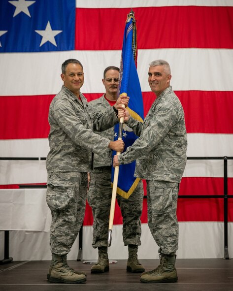 Col. Keith Wesley, 934th Airlift Wing commander, and Mr. Bill Pool, local American Federation of Government Employees president, sign the new collective bargaining agreement between the 934th Airlift Wing and the AFGE union. The new agreement will run for five years. (Air Force Photo by Paul Zadach/Released).