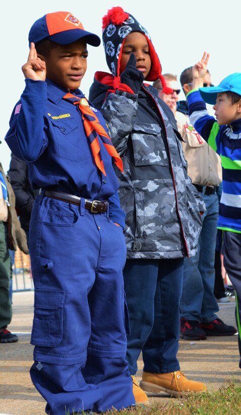 Brian Simmons, a Tiger Cub Scout from Troop 160 of the Cradle of Liberty Council, Boy Scouts of America, recites the Boy Scout oath while displaying the Cub Scout salute during the opening ceremonies of the “Rocket Into Scouting” recruitment event hosted by the 111th Attack Wing , Oct. 24, 2015, Horsham Air Guard Station, Pennsylvania. The event included deploying rockets from the tarmac, static displays from the base’s RED HORSE, Detachment 1, as well as base tours and the opportunity to earn the Aviation Merit Badge. (U.S. Air National Guard photo by Senior Airman Michael Bolden/Released)