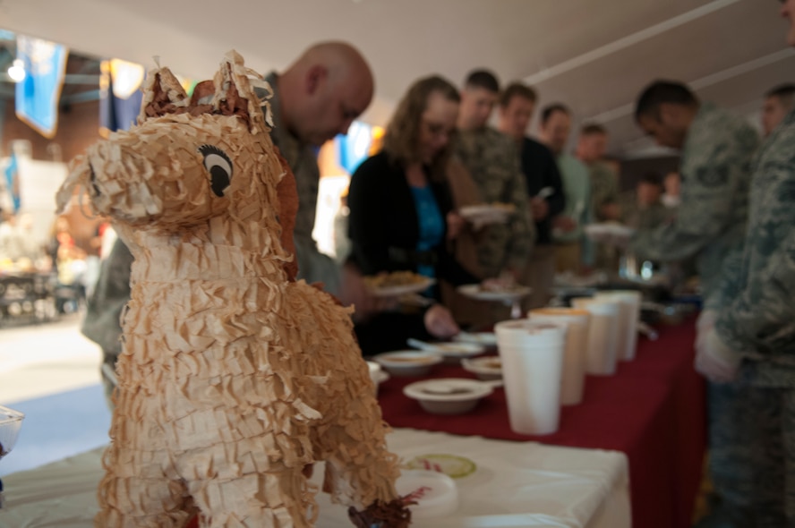 A piñata welcomes people as they line up for food in the Fall Hall Community Center, Oct. 27, 2015, during this year’s National Hispanic Heritage Observance. Those in attendance were treated to a variety of Hispanic dishes as well as music in support of the culture. (U.S. Air Force photo by Airman 1st Class Malcolm Mayfield)