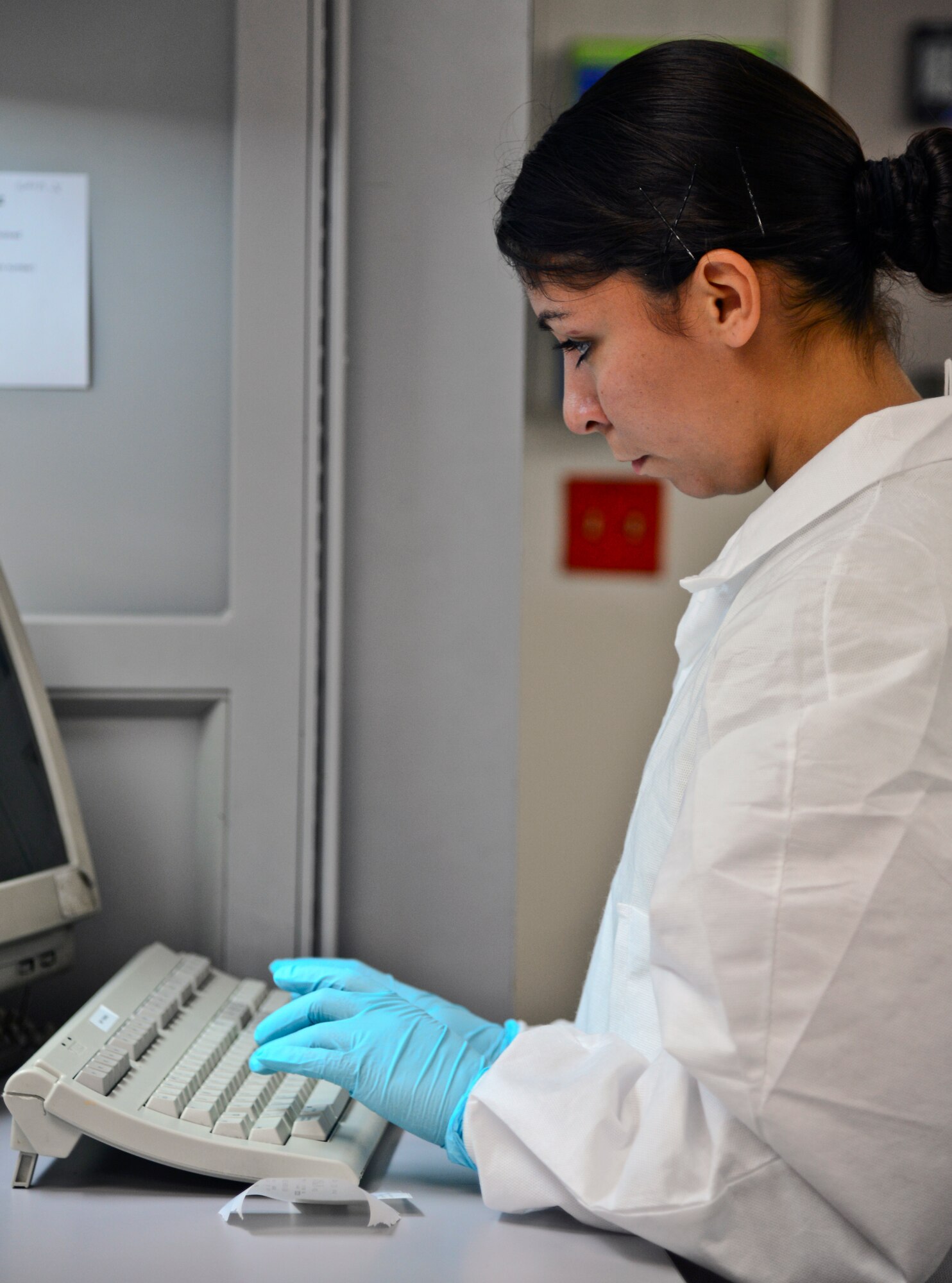 Staff Sgt. Mayra Autagne, 51st Medical Support Squadron laboratory technician and NCO in charge of shipping, inputs blood-sample data for processing in the laboratory at Osan Air Base, Republic of Korea, Oct. 21, 2015. The Osan lab processes more than 8,000 tests each month. (U.S. Air Force photo/Tech. Sgt. Travis Edwards)