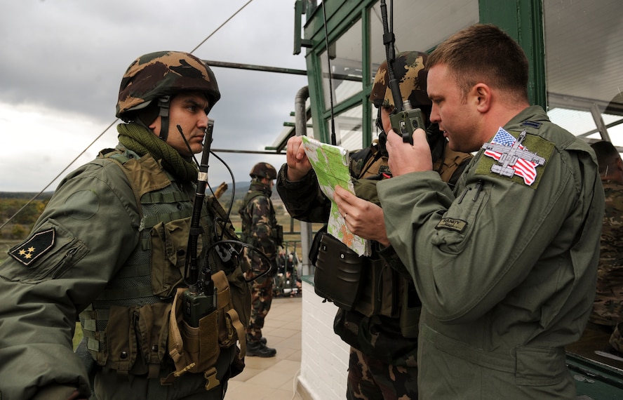 U.S. Air Force Capt. Joshua Geidel, a 74th Expeditionary Fighter Squadron A-10 Thunderbolt II attack aircraft pilot assigned to the 23d Wing at Moody Air Force Base, Georgia, talks with Hungarian joint terminal attack controllers as part of NATO exercise Brave Warrior 2015 at Bakony Combat Training Centre, Veszprem, Hungary, Oct. 21, 2015. Geidel, deployed from Moody Air Force Base, Ga., worked directly with the Hungarian Defense Forces and acted as the range safety control officer for the A-10s during Brave Warrior’s live-fire exercises. (U.S. Air Force photo by Andrea Jenkins/Released)