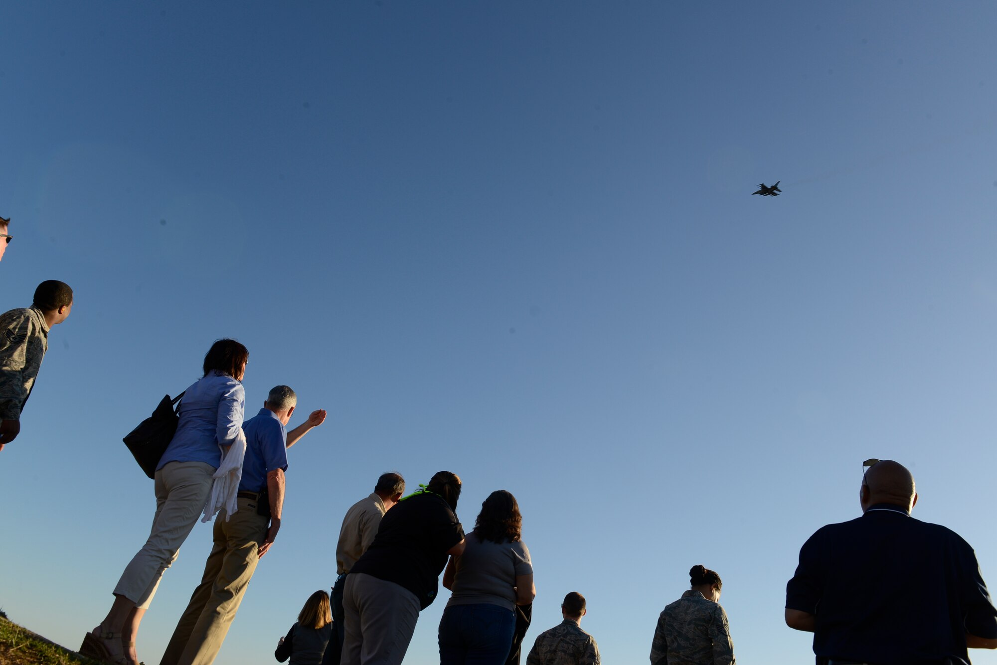 An F-16CM Fighting Falcon assigned to the 77th Fighter Squadron flies over spectators at Poinsett Electronic Combat Range, Wedgefield, S.C., Oct. 15, 2015. The Fighting Falcons flew a total of eight passes, firing more than 2,000 bullets from its 20mm Gatling into the ground. (U.S. Air Force photo by Airman 1st Class Christopher Maldonado/Released)