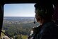 Airman 1st Class Jordan Costilla, 4th Operations Support Squadron air traffic control apprentice, observes Wayne County during an incentive flight, Oct. 21, 2015. Team Seymour Airmen were given flights in a helicopter by the Wayne County Sheriff’s Office aviation unit after a discussion about how communication and coordination between Seymour Johnson Air Force Base, North Carolina and the WCSO can benefit from observing the other’s perspective. (U.S. Air Force photo/Airman 1st Class Ashley Williamson)