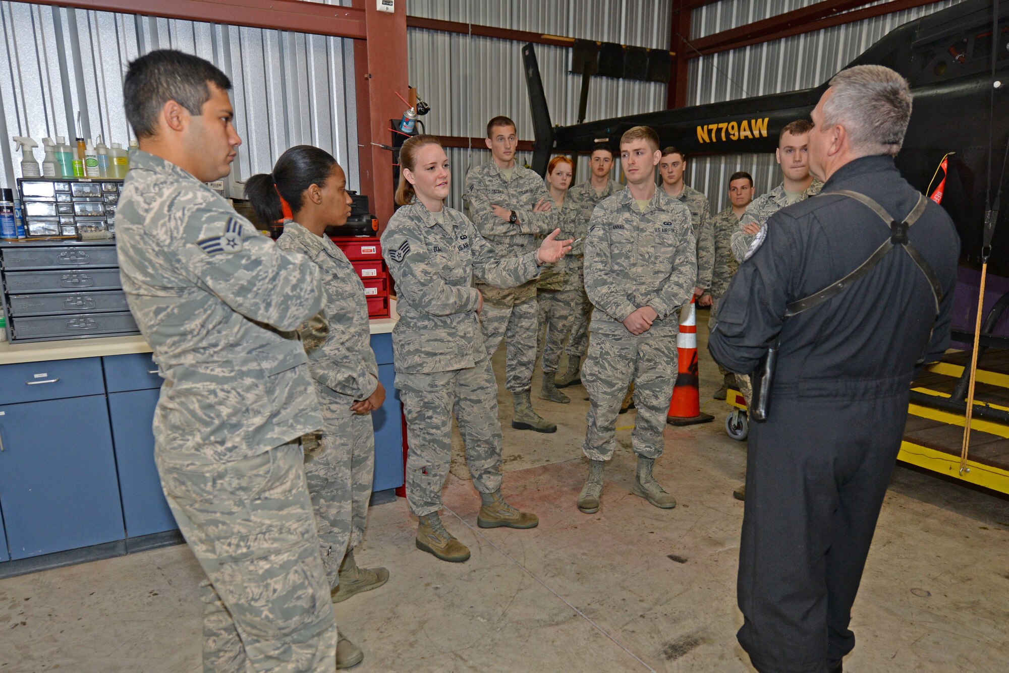 Staff Sgt. Abigail Diaz, 4th Operations Support Squadron tower watch supervisor, discusses improving interagency coordination with Lt. Tom Parker, Wayne County Sheriff’s Office aviation unit chief pilot, Oct. 21, 2015, at the Wayne Executive Jetport, Goldsboro, North Carolina. Team Seymour Airmen from the 4th OSS were briefed on the roles the WCSO aviation unit performs and how it is necessary to communicate efficiently with the base. (U.S. Air Force photo/Airman 1st Class Ashley Williamson)