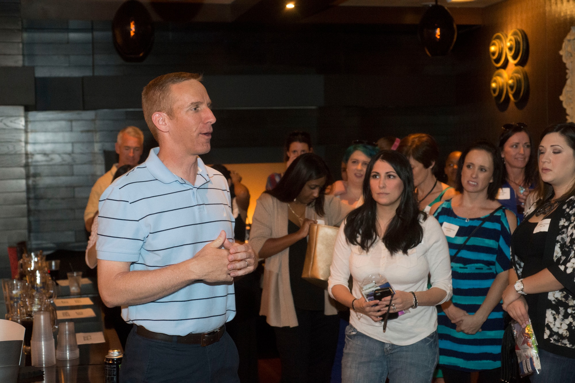 Col. Case Cunningham, 432nd Wing/432nd Air Expeditionary Wing commander addresses spouses during t “Spoil the Spouse” in Las Vegas, Nevada, Oct 24, 2015. The Creech C.A.R.E.S., initiative gives families a way to interact with each other through events like the “Spoil the Spouse” event. Although this group is new there are plans to host events every month not only to show appreciation but also to give families social interaction with others which is sometimes difficult due to Creech’s remote location. (U.S. Air Force photo by Senior Airman Adarius Petty)
