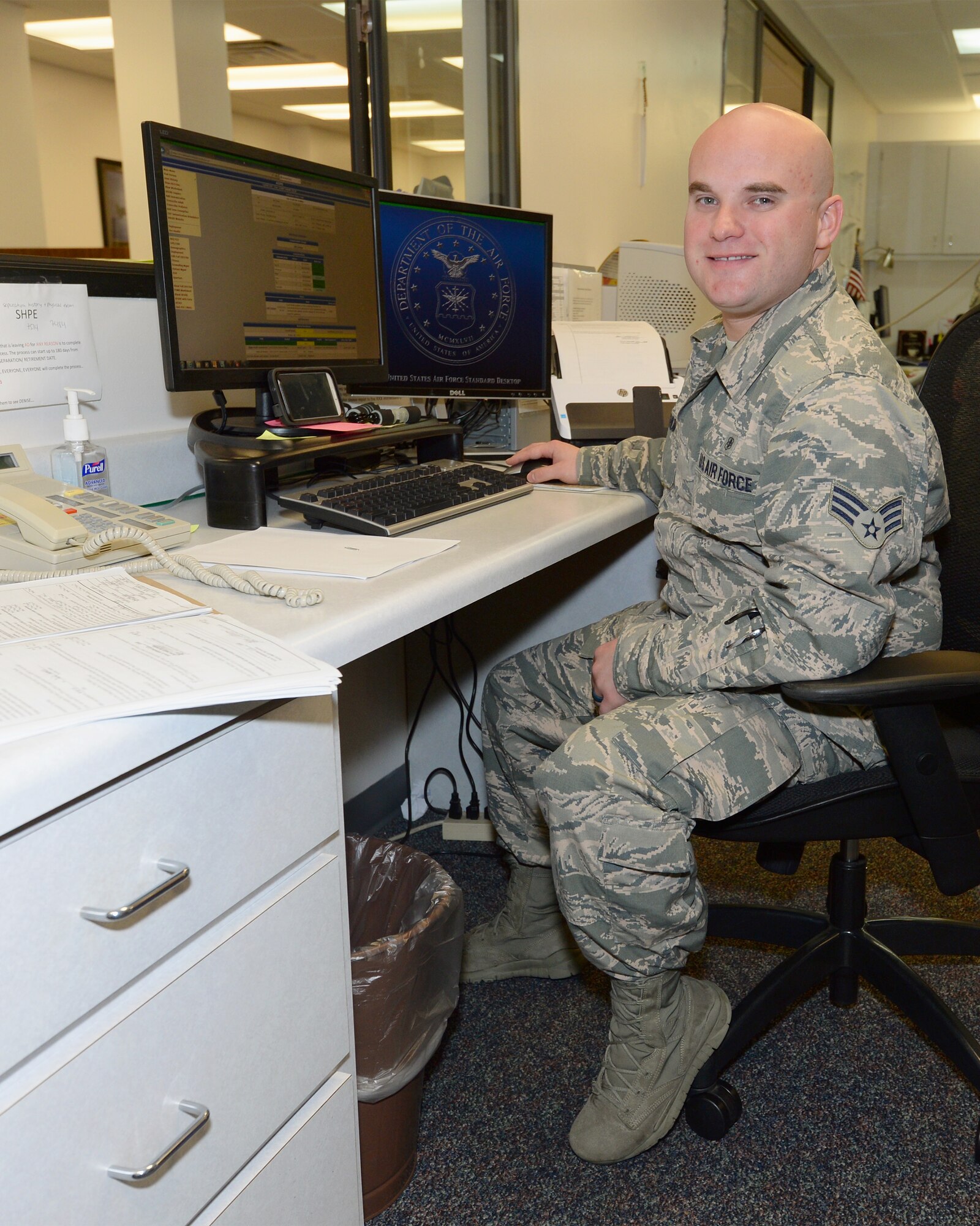 Senior Airman Tyler Washum, 325th Aerospace Medicine Squadron public health technician mans the front desk for his office, Oct. 5th.  Members of the 325th AMDS have the mission of supporting the 325th Fighter Wing by providing medical, dental, and preventive care enabling all wing and associate units to maximize readiness and combat capability. (U.S. Air Force photo by Airman 1st Class Cody R. Miller)