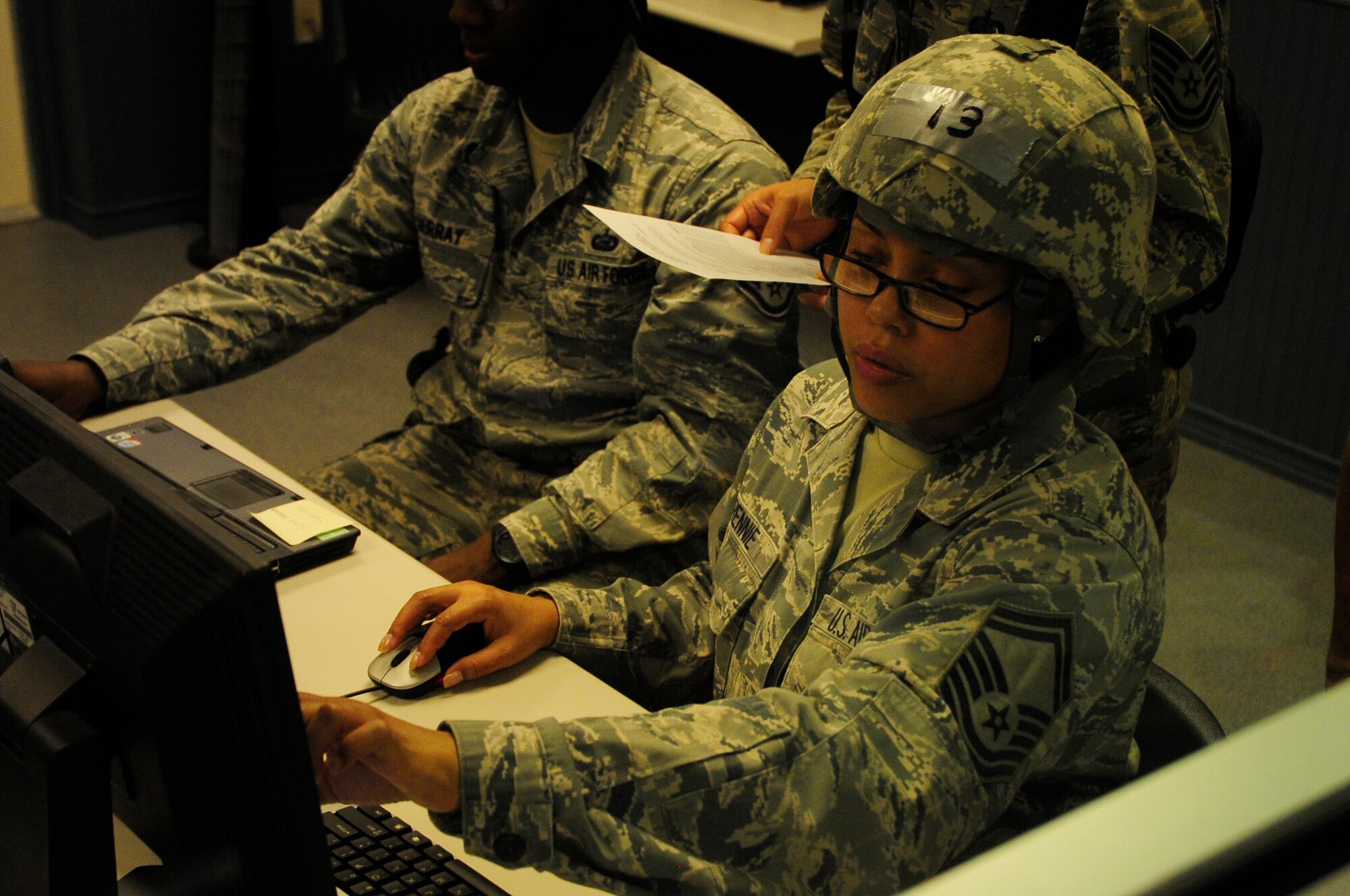 Senior Master Sgt. Angelic Rennie, 823rd REDHORSE Squadron Detachment 1 manpower student, checks and maintains the proper manpower via a computer station Oct. 22 at the Silver flag site as they establish a Forward Operating Base simulation in Location X.  During the seven day Silver Flag course, civil engineers, communications, force support, and finance personnel learn how to build and maintain bare-base operations at a forward-deployed location. Students hone a variety of combat and survival skills, such as repairing bomb-damaged runways and setting up base facilities; fire fighters receive specific expeditionary training that supply the combatant commander with a highly trained and skilled emergency response force. (U.S. Air Force photo by Senior Airman Solomon Cook/Released)