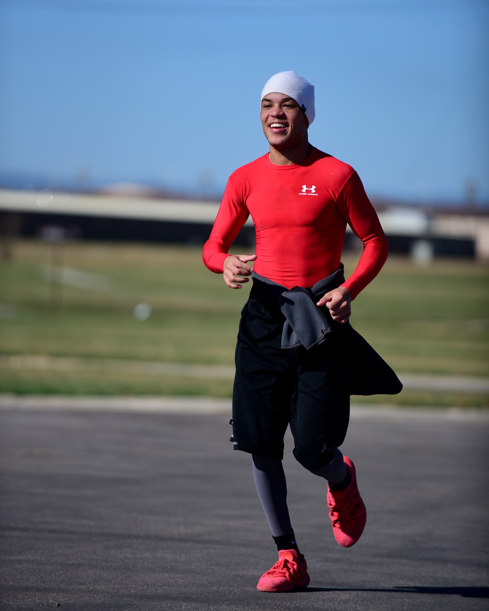 Airman 1st Class Dakkaan Mnyamani-Howell, 28th Comptroller Squadron financial services technician, finishes the final leg of the Fall Triathlon at the Bellamy Fitness Center at Ellsworth Air Force Base, S.D., Oct. 17, 2015. Mnyamani-Howell and his team won first place in their division with a time of 1:05:04. (U.S. Air Force photo by Airman 1st Class James L. Miller/Released)