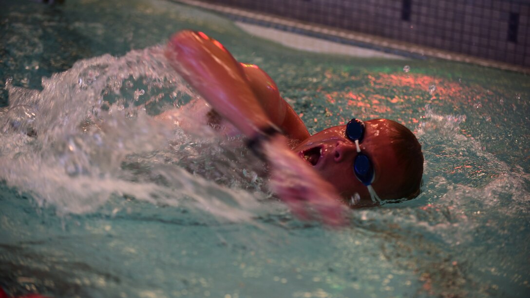 Second Lt. Corey Hayes, 28th Force Support Squadron readiness officer in charge, comes up for air during the swim portion of the Fall Triathlon at the Bellamy Fitness Center at Ellsworth Air Force Base S.D., Oct. 17, 2015. Hayes received a gold medal in his division, completing the triathlon with a time of 1:03:33 – the fastest time of the day. (U.S. Air Force photo by Airman 1st Class James L. Miller/Released)