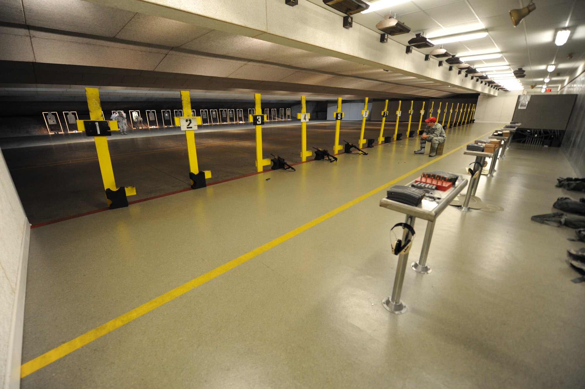 Ellsworth’s combat arms range is an indoor facility used for firearms training at Ellsworth Air Force Base, S.D., Oct. 13, 2015. Personnel eligible for CA courses include deployers and those with duty qualification requirements, such as explosive ordnance disposal teams, security forces personnel and members of Air Force Office of Special Investigations. (U.S. Air Force photo by Airman Sadie Colbert/Released)