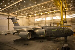 This C-17 Globemaster III is in the process of being sanded, washed, and painted by members of the 437th Maintenance Squadron at Joint Base Charleston – Air Base, S.C., on Oct. 15, 2015. This facility is used for the sanding and painting maintenance for local JB Charleston aircraft. (U.S. Air Force photo/Airman 1st Class Thomas T. Charlton)
