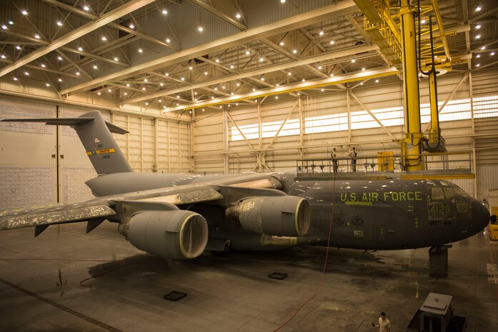 This C-17 Globemaster III is in the process of being sanded, washed, and painted by members of the 437th Maintenance Squadron at Joint Base Charleston – Air Base, S.C., on Oct. 15, 2015. This facility is used for the sanding and painting maintenance for local JB Charleston aircraft. (U.S. Air Force photo/Airman 1st Class Thomas T. Charlton)