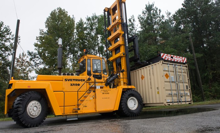 The Army Pre-Position Stocks Afloat program moves a shipment of ammunition to be loaded aboard the Unites States Naval Ship Red Cloud at Joint Base Charleston – Naval Weapons Station on Oct. 27, 2015. The USNS Red Cloud is packed with vehicles and equipment so that the Unites States military can deploy quickly and efficiently.