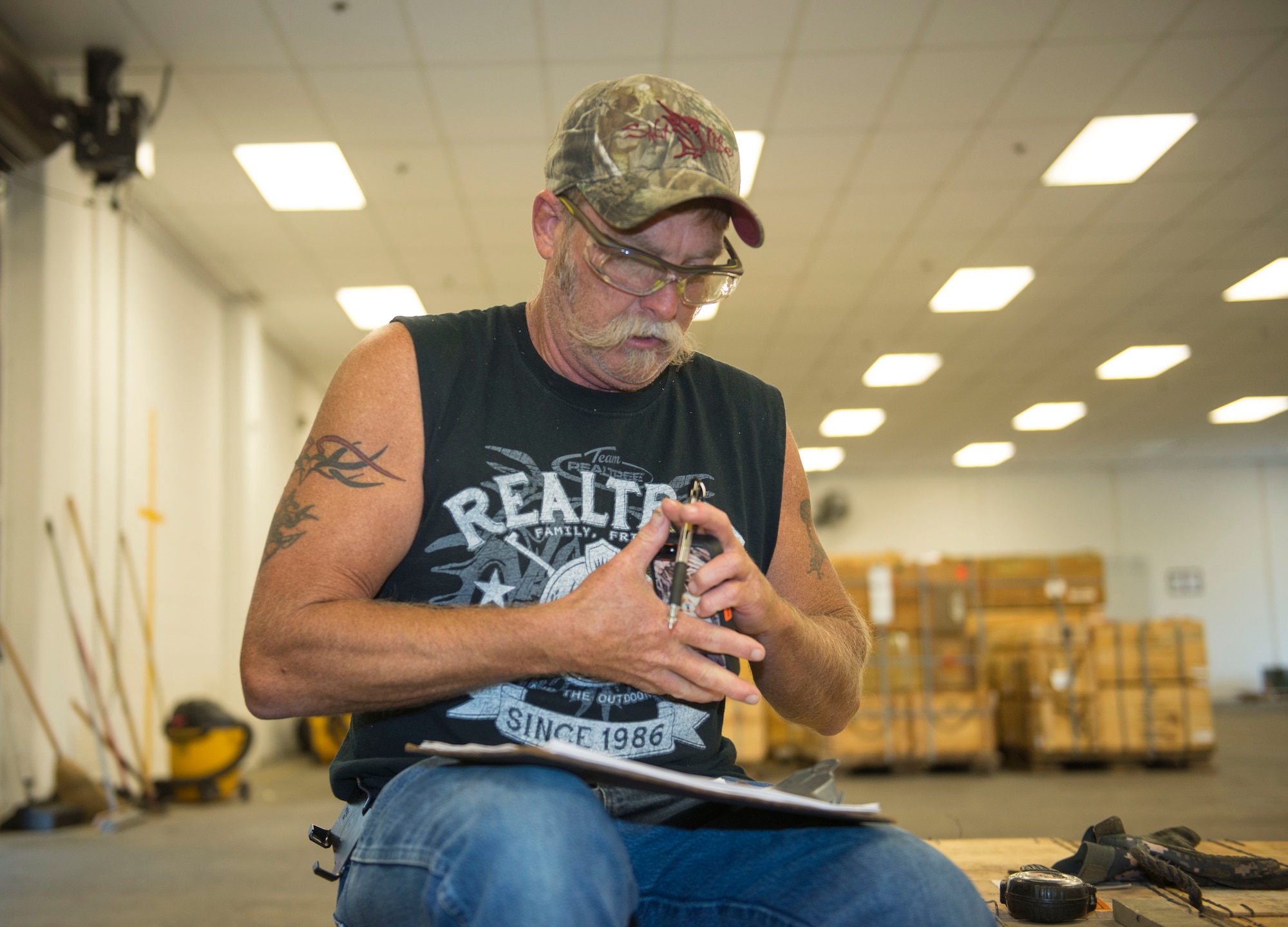 Bryan Shaw, Naval Munitions Command Atlantic Unit Charleston work leader, reviews the inventory of all the equipment to be reloaded aboard the United States Naval Ship Red Cloud on Oct. 27, 2015, at Joint Base Charleston – Naval Weapons Station. Shaw ensures all the equipment is cleared and aboard USNS Red Cloud to meet its two-week deadline.