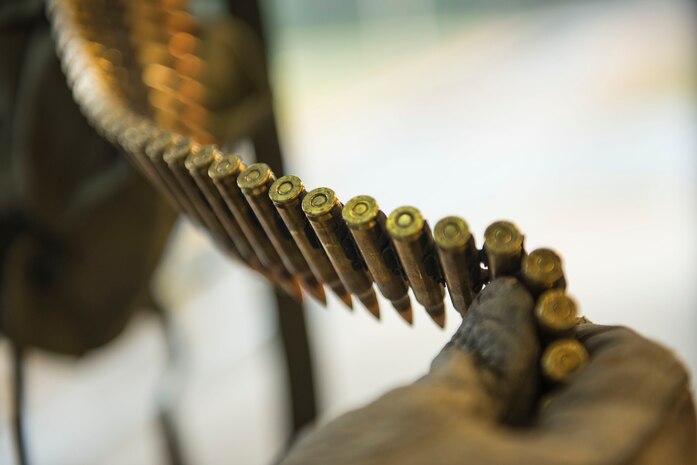 Jeff Jetton, Quality Assurance Specialists for Ammunition Surveillance inspector, views the ammunition to ensure is stored in the proper container before loading on USNS Red Cloud  on Oct 27, 2015 at, Joint Base Charleston – Naval Weapons Station. Jetton is a manager from the headquarters of Army Sustainment Command located in Rock Island, Illinois.