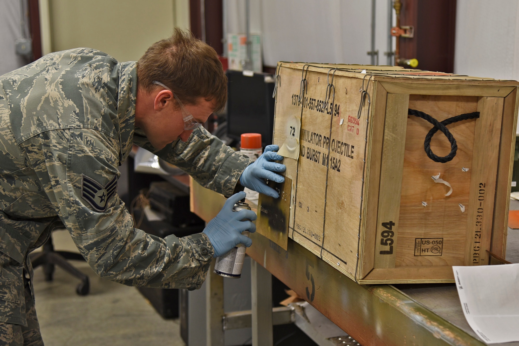 Staff Sgt. James Koenig, 92nd Maintenance Squadron senior munitions inspection, prepares a munitions package for account delivery and storage Oct. 28, 2015, at Fairchild Air Force Base, Wash. Koenig conducts a receiving inspection when shipments arrive and ensures boxes haven’t been damaged. Munitions storage then moves the ammo to a superstructure storage location. (U.S. Air Force photo/Airman 1st Class Mackenzie Richardson)