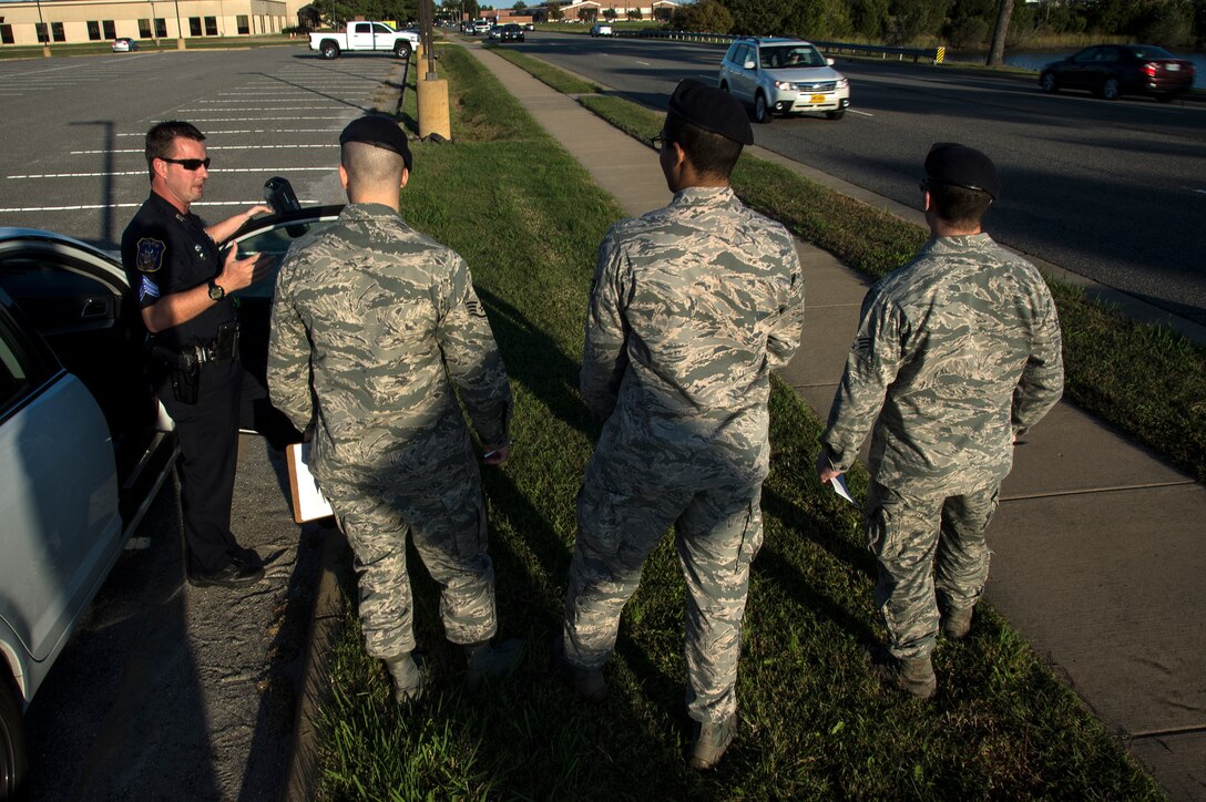 U.S. Air Force Airmen assigned to the 633rd Security Forces Squadron train with Sgt. Pelham Felder, Hampton Police Division Homeland Security unit supervisor, on basic radar operation at Langley Air Force Base, Va., Oct. 15, 2015. During training, Airmen learned about the Doppler Theory and principles, how to set up and test radars and how to visually estimate the speed of a vehicle. (U.S. Air Force photo by Senior Airman Kayla Newman/Released)