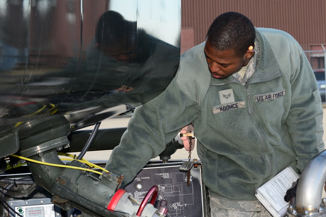 U.S. Air Force Senior Airman Terry Koonce, 633rd Logistics Readiness Squadron fuels distributor, pumps gas into a fuel truck at Langley Air Force Base, Va., Oct. 19, 2015. As a fuel Airman, Koonce tracks and stores petroleum products for use in Air Force vehicles and aircraft. (U.S. Air Force photo by Senior Airman Kimberly Nagle/Released)   