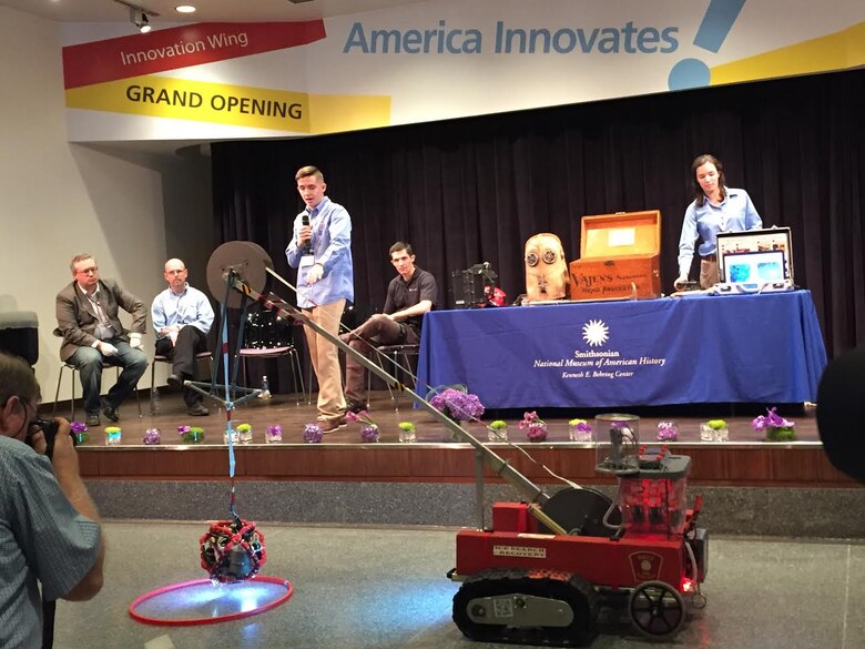 Airman 1st Class Ford Grundberg, 3rd Space Operations Squadron Defense Satellite Communications System satellite vehicle operator, presents the search and rescue robot he and his team invented at the Lemelson Foundation 20th anniversary Sept. 18, 2015, in the Smithsonian Museum of Natural History in Washington, D.C. Grundberg explained his presentation was the first opportunity he’s ever had to speak in front of a crowd. (Courtesy Photo)  