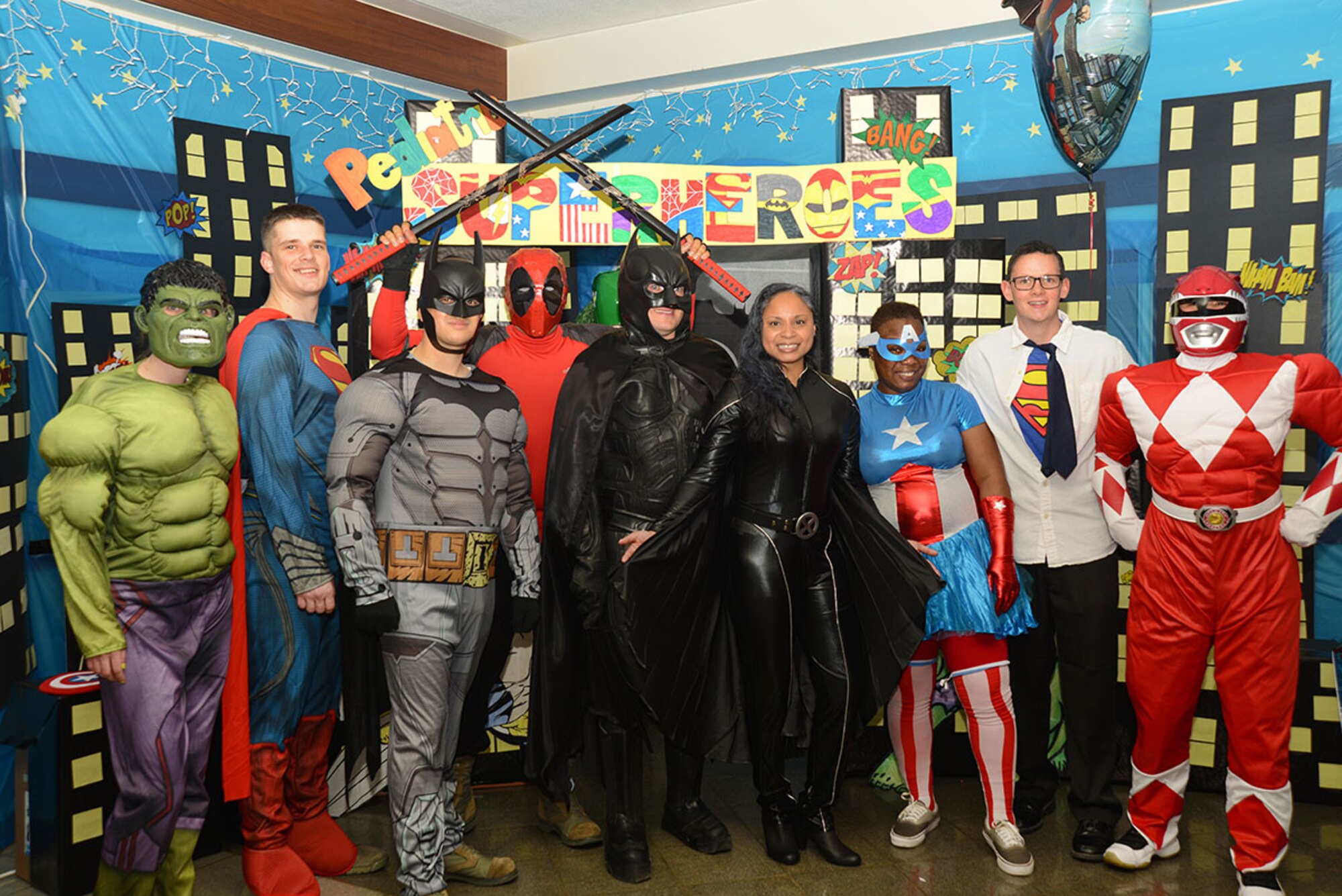 673d Medical Operation Squadron Pediatric Clinic ‘superheroes’ pose for a photo at the hospital on Joint Base Elmendorf-Richardson, Alaska, Oct. 23, 2015. This annual event allowed kids to associate hospitals with more than just flu shots and medicine, but friendly fun as well. (U.S. Air Force photo/Airman 1st Class Christopher R. Morales)