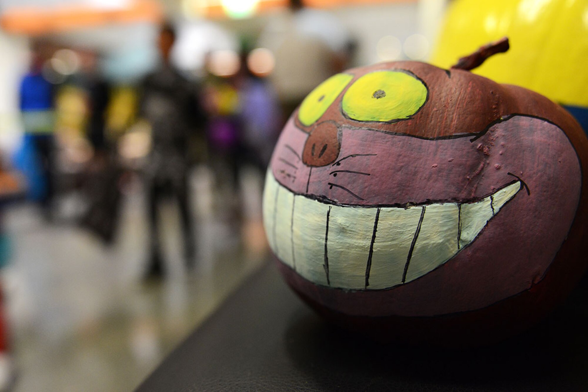 A ‘Cheshire Cat’ pumpkin grins at passing pedestrians during the Trick-or-Treat event at the hospital on Joint Base Elmendorf-Richardson, Alaska, Oct. 23, 2015. Many employees dressed according to a theme within their respective clinics and handed candy to people of all ages during the annual event. This event allows children to associate hospitals with more than just flu shots and medicine, but friendly fun as well. (U.S. Air Force photo/Airman 1st Class Christopher R. Morales)
