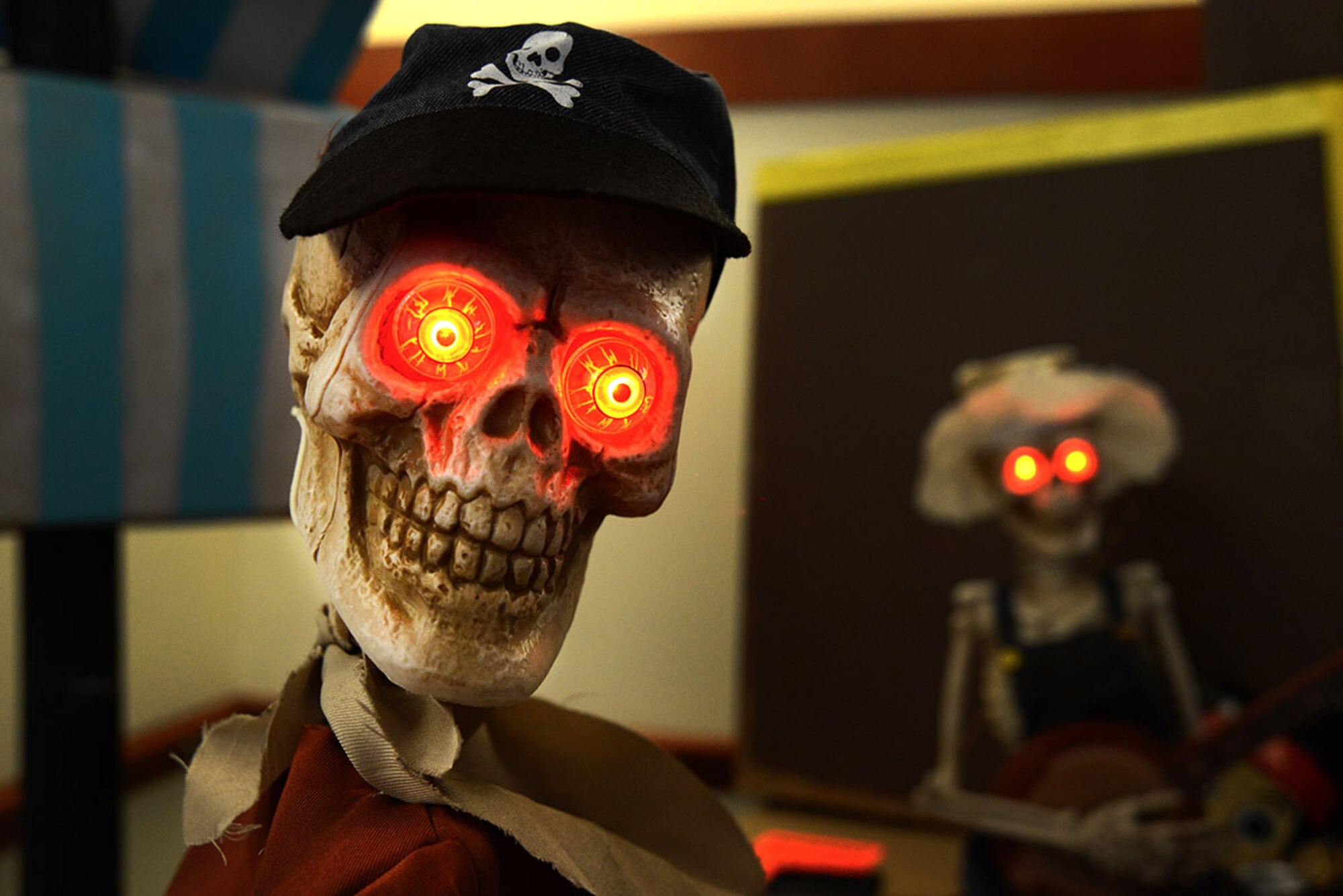 Two skeletons loom in the background of the 673d Surgical Operations Squadron Perianesthesia Flight’s ‘Jake and the Neverland Pirate’ theme at the Joint Base Elmendorf-Richardson Hospital, Alaska, Oct. 23, 2015. This annual event allowed children to associate hospitals with more than just flu shots and medicine, but friendly fun as well. (U.S. Air Force photo/Airman 1st Class Christopher R. Morales)