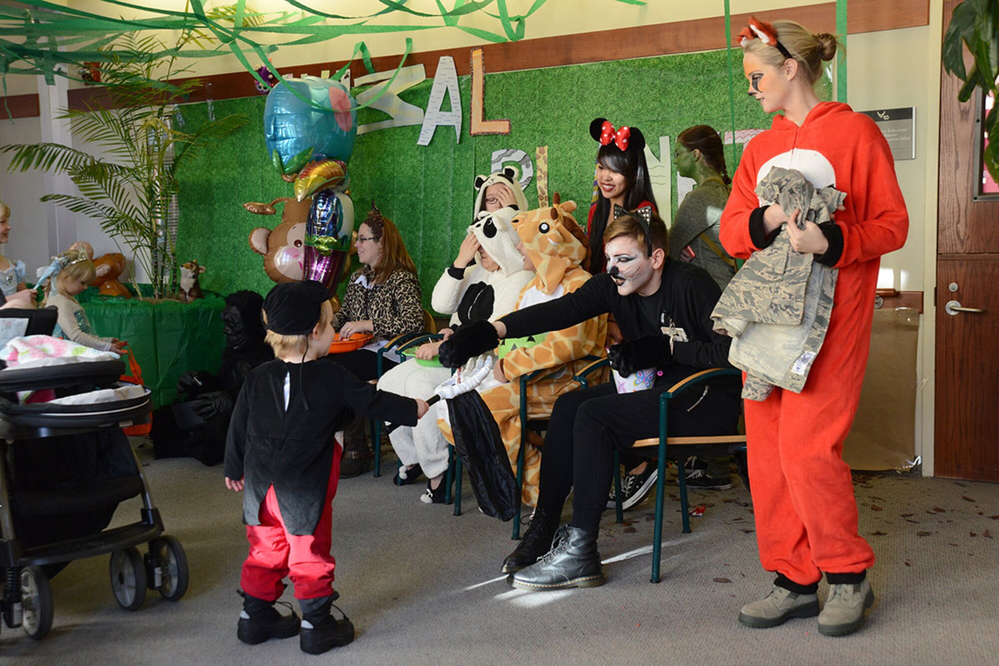 673d Medical Support Squadron Exceptional Family Member Program workers dressed as an ‘Animal Planet’ theme and handed out candy at the Joint Base Elmendorf-Richardson Hospital, Alaska, Oct. 23, 2015. This annual event allowed kids to associate hospitals with more than just flu shots and medicine, but friendly fun as well. (U.S. Air Force photo/Airman 1st Class Christopher R. Morales)