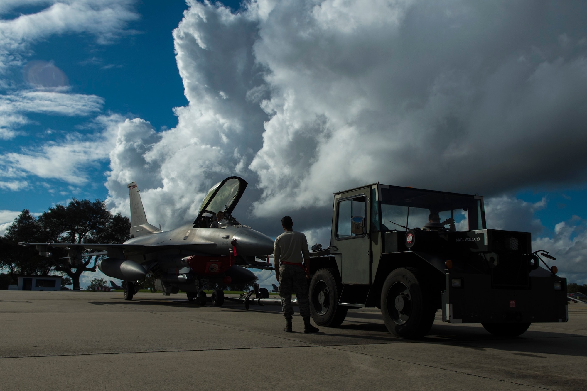 BEJA AIR BASE, Portugal – Members of the 52nd Maintenance Group prepare to tow an F-16 Fighting Falcon fighter aircraft, assigned to the 480th Fighter Squadron at Spangdahlem Air Base, Germany, during Trident Juncture 2015 at Beja Air Base, Portugal, Oct. 27, 2015. More than 100 Airmen assigned to the 52nd Maintenance Group deployed to Portugal in support of Trident Juncture 2015, the largest NATO exercise conducted in the past 20 years. (U.S. Air Force photo by Airman 1st Class Luke Kitterman/Released)