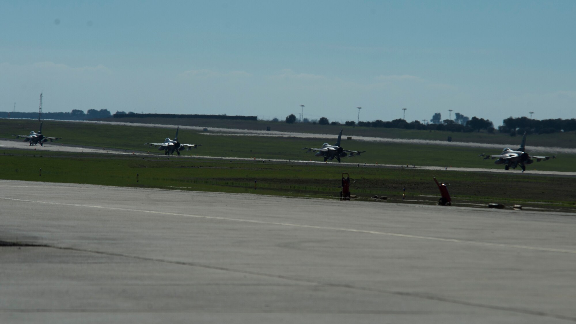 BEJA AIR BASE, Portugal – Four F-16 Fighting Falcon fighter aircraft, assigned to the 480th Fighter Squadron at Spangdahlem Air Base, Germany, taxi down the runway before takeoff at Exercise Trident Juncture 2015 at Beja Air Base, Portugal, Oct. 22, 2015. Trident Juncture is an annual NATO Response Force certification exercise. (U.S. Air Force photo by Airman 1st Class Luke Kitterman/Released)  