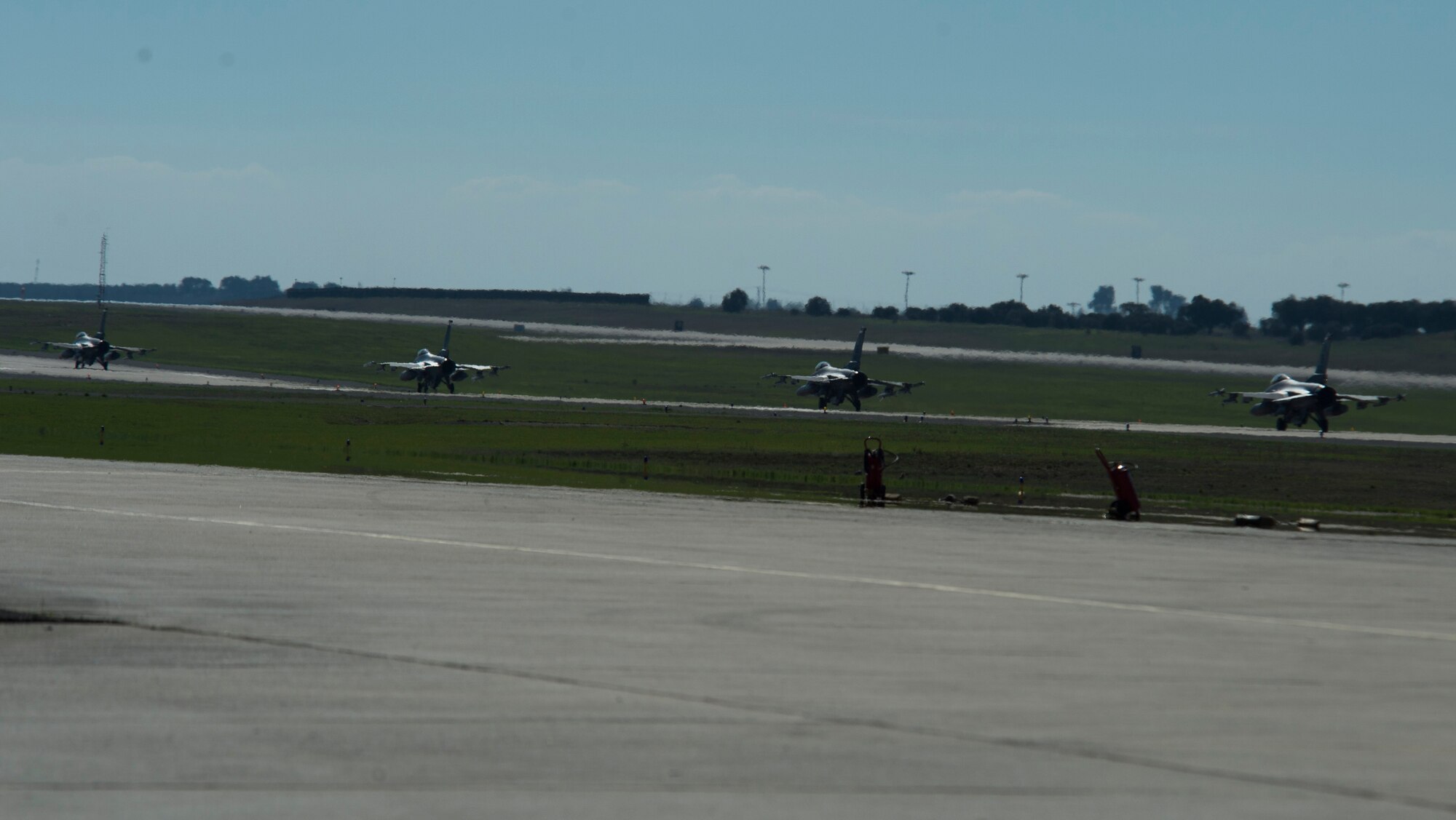 BEJA AIR BASE, Portugal – Four F-16 Fighting Falcon fighter aircraft, assigned to the 480th Fighter Squadron at Spangdahlem Air Base, Germany, taxi down the runway before takeoff at Exercise Trident Juncture 2015 at Beja Air Base, Portugal, Oct. 22, 2015. Trident Juncture is an annual NATO Response Force certification exercise. (U.S. Air Force photo by Airman 1st Class Luke Kitterman/Released)  