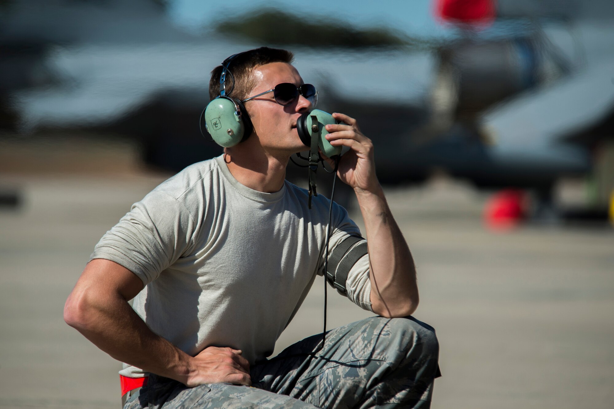 BEJA AIR BASE, Portugal – U.S. Air Force Senior Airman Kyle Sumpter, 52nd Aircraft Maintenance Squadron crew chief from Spangdahlem Air Base, Germany, speaks to an F-16 Fighting Falcon fighter aircraft pilot assigned to the 480th Fighter Squadron while conducting a pre-flight check before a mission at Exercise Trident Juncture 2015 at Beja Air Base, Portugal, Oct. 22, 2015. The crew chief is responsible for the maintenance, upkeep, appearance and overall condition of the aircraft. (U.S. Air Force photo by Airman 1st Class Luke Kitterman/Released)  