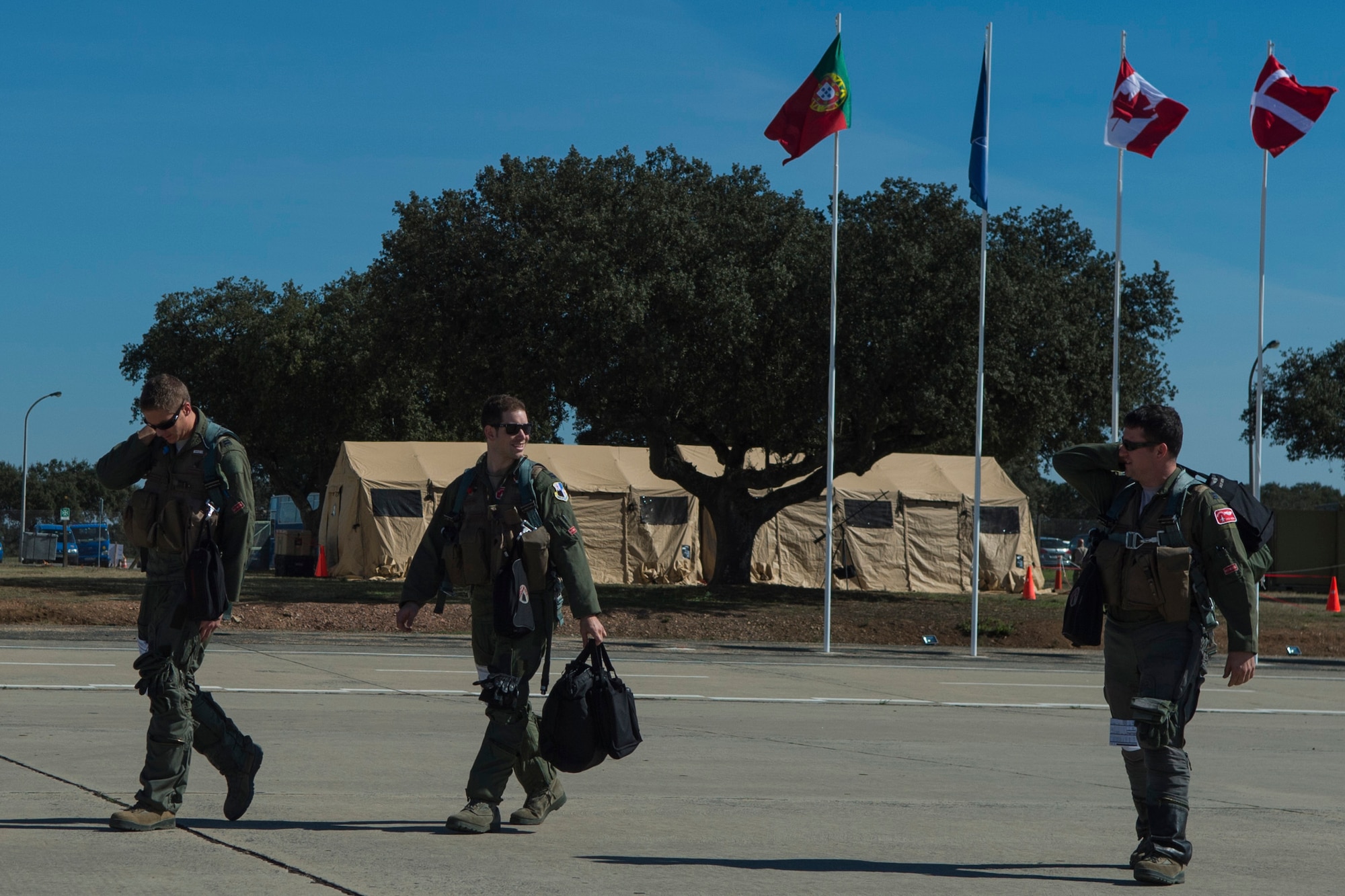 BEJA AIR BASE, Portugal – Pilots assigned to the 480th Fighter Squadron at Spangdahlem Air Base, Germany, walk out to F-16 Fighting Falcon fighter aircraft while participating in Trident Juncture 2015 at Beja Air Base, Portugal, Oct. 22, 2015. More than 40 aircraft from nine nations and 3,000 military members are deployed to Portugal in support of Trident Juncture 2015. (U.S. Air Force photo by Airman 1st Class Luke Kitterman/Released)