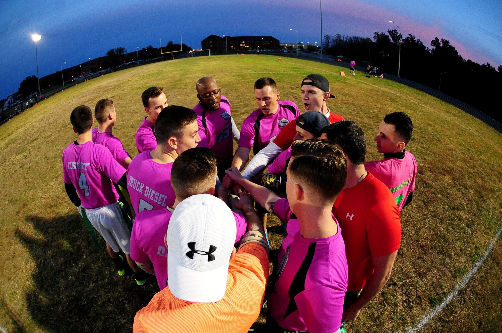 Members of the 509th Operations Support Squadron (OSS) huddle during halftime of the intramural flag-football championship game at Whiteman Air Force Base, Mo., Oct. 26, 2015. At halftime, the 509th Security Forces Squadron was leading with a score of 16-8. The 509th Security Forces Squadron would go on to defeat the 509th OSS with a score of 32-24. (U.S. Air Force photo by Senior Airman Joel Pfiester/Released)