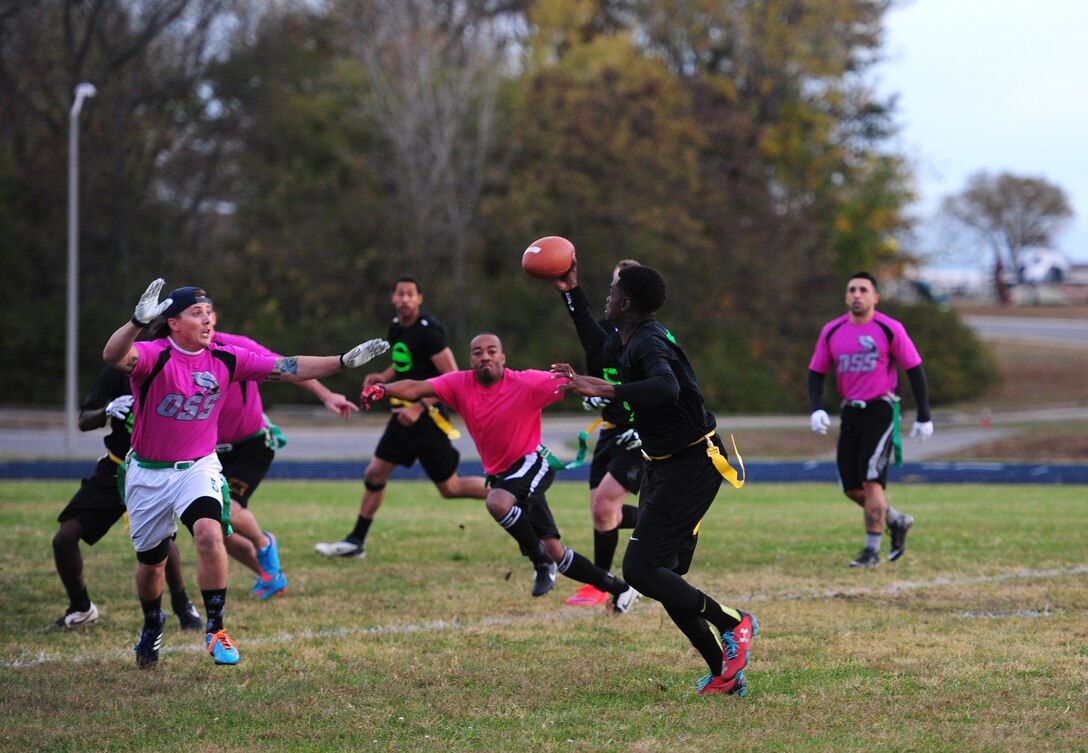 U.S. Air Force Staff Sgt. Deleon West, 509th Security Forces Squadron (SFS) NCO in charge of Lemay search, scrambles out of the pocket during the intramural flag-football championship game at Whiteman Air Force Base, Mo., Oct. 26, 2015. The 509th SFS faced off against the 509th Operations Support Squadron (OSS). The 509th Security Forces Squadron would go on to defeat the 509th OSS with a score of 32-24. (U.S. Air Force photo by Senior Airman Joel Pfiester/Released)