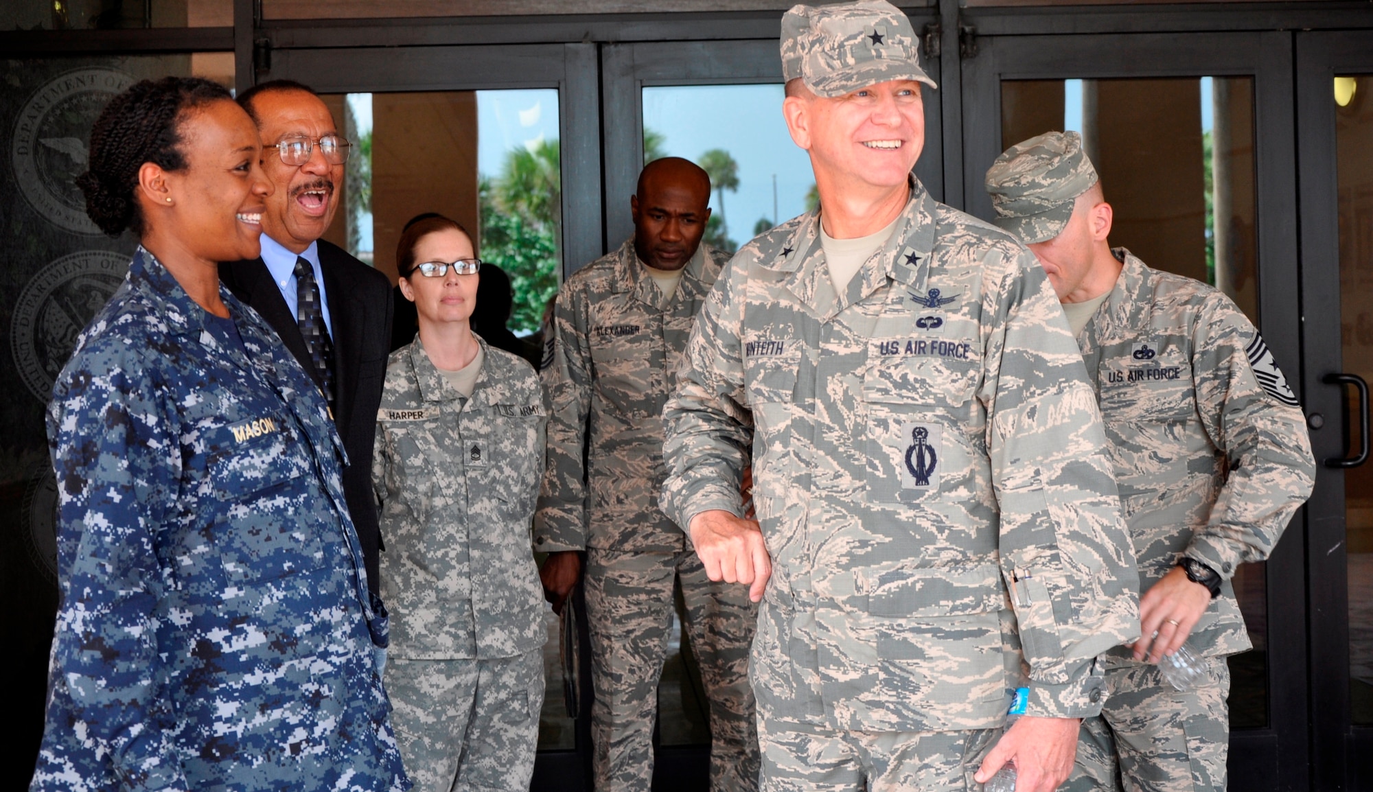 Brig. Gen. Wayne R. Monteith, 45th Space Wing commander, right, is all smiles as he departs the Defense Equal Opportunity Management Institute, Oct. 21, 2015. Wishing him well are (left to right), Navy Commander Yolanda K. Mason, DEOMI Chief of Staff / Acting Commandant, Dr. Jose Bolton, Sr., DEOMI Dean, Sgt. 1st Class Jennifer Harper, DEOMI Public Affairs NCOIC, Chief Master Sgt. Boston Alexander, DEOMI Senior Enlisted Advisor, and Chief Master Sgt. Jason A. Lamoureux, 45th Space Wing command chief, (partially hidden behind Monteith. (U.S. Air Force photo/Christopher Calkins) 