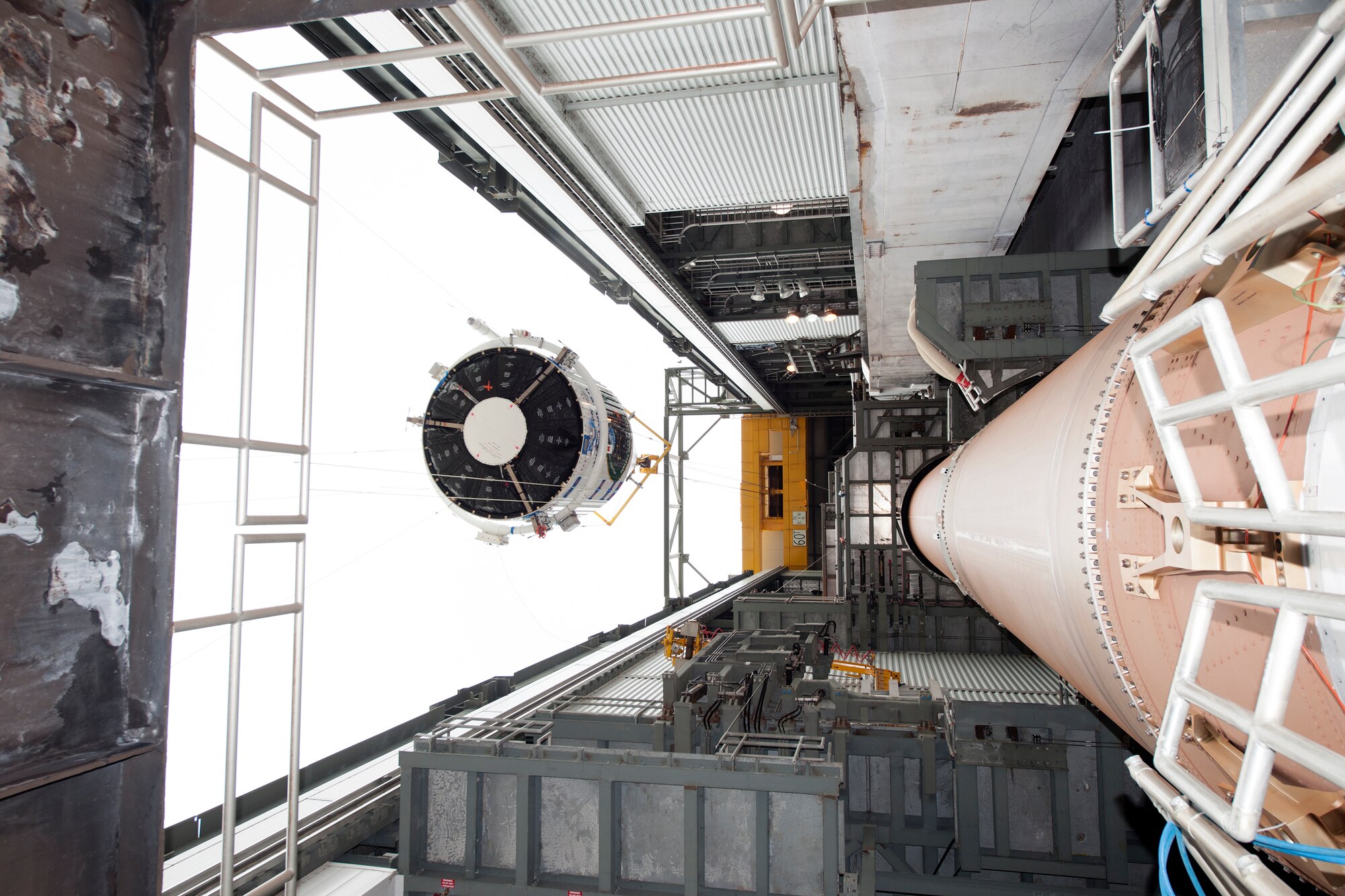 The encapsulated GPS IIF-11 satellite is lifted Oct. 21 for stacking atop a United Launch Alliance Atlas V 401 booster at the Vertical Integration Facility near Space Launch Complex 41, Cape Canaveral Air Force Station, Fla. GPS IIF satellites provide improved signals that will enhance the precise global positioning, navigation and timing services supporting both the warfighter and the growing civilian needs of our global economy. GPS IIF satellites provide improved navigational accuracy through advanced atomic clocks, a longer design life than previous GPS satellites, and a third operational civil signal (L5) that benefits commercial aviation and safety-of-life applications. The Air Force and its mission partners are scheduled to launch GPS IIF-11 from SLC-41 at CCAFS on Oct. 30. The launch window opens at 12:17 p.m. EDT and will remain open for 18 minutes. (Courtesy photo: United Launch Alliance)  