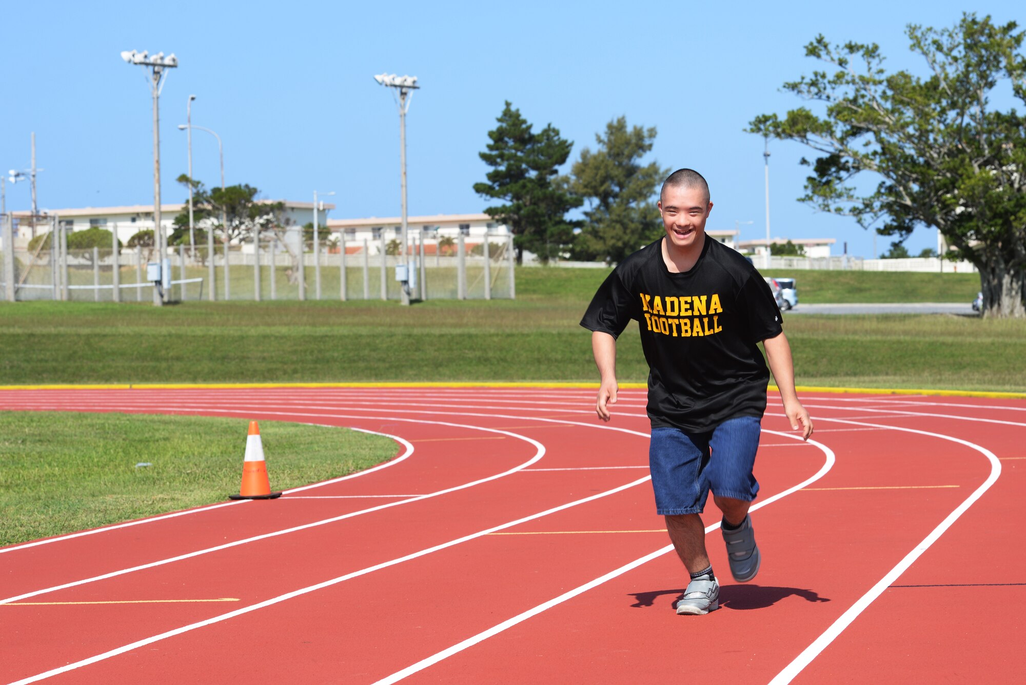 Ty Murdock, Kadena High School 12th grade student, practices for the 30-meter dash of the Kadena Special Olympics at the high school track Oct. 27, 2015, on Kadena Air Base, Japan. Murdock will compete again this year at the KSO. Last year, he placed first in his heat and practices for this year’s event by running around his neighborhood block and hiking for miles with his father. (U.S. Air Force photo by Senior Airman Omari Bernard)