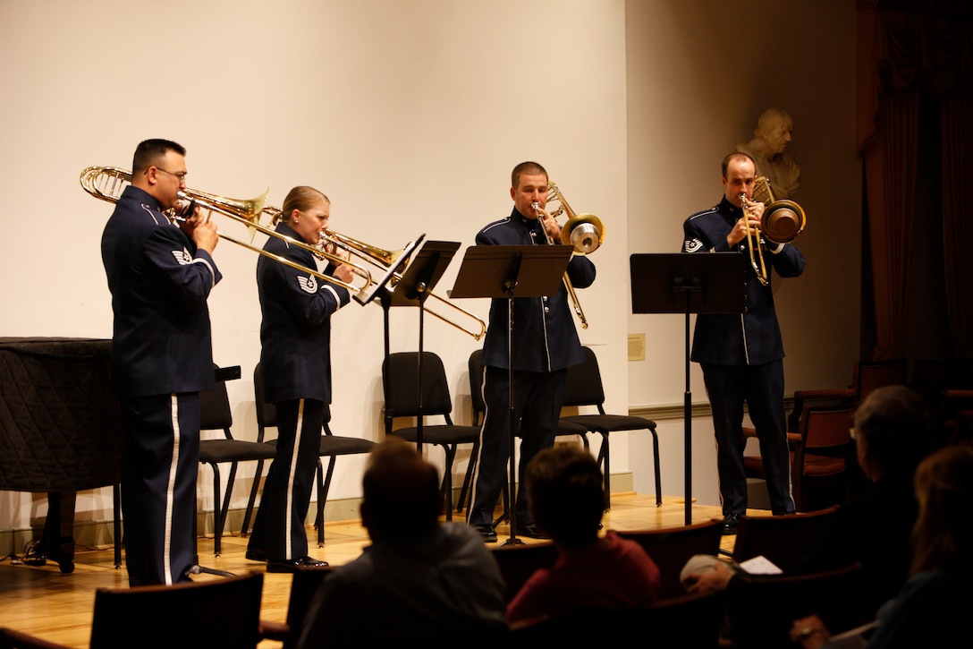 Technical Sgts. Kaz Kruszewski, Christine Purdue, Tim Hilgert and Master Sgt. Aaron Moats perform in a trombone quartet during a chamber concert put on by the Ceremonial Brass. The performance took place October 22 at the Lyceum Museum in Alexandra, VA, and was part of the USAF Band's Chamber Players Series. (U.S. Air Force photo by Technical Sgt. Matthew Shipes/released).