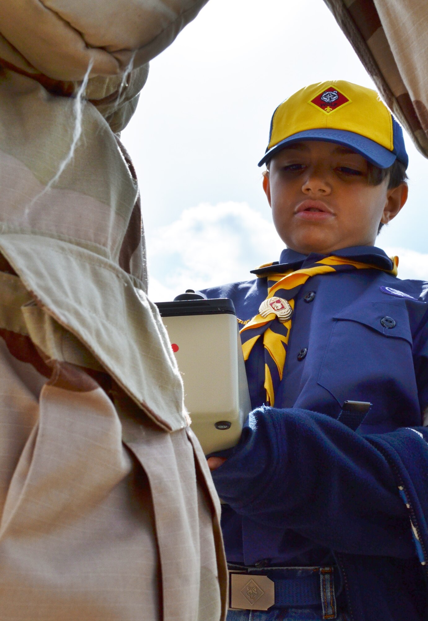 Giovanni Dialogue, a Wolf Scout from Troop 72, part of the Cradle of Liberty Council, Boy Scouts of America, inspects a mannequin dressed in Level 4 Mission Oriented Protective Posture during the Boy Scouts of America, “Rocket Into Scouting” event held Oct. 24, 2015 at Horsham Air Guard Station, Pennsylvania. The event featured construction and rocket launch, static heavy-equipment displays, a walking base tour and an emergency systems management presentation. (U.S. Air National Guard photo by Senior Airman Michael Bolden/Released) 