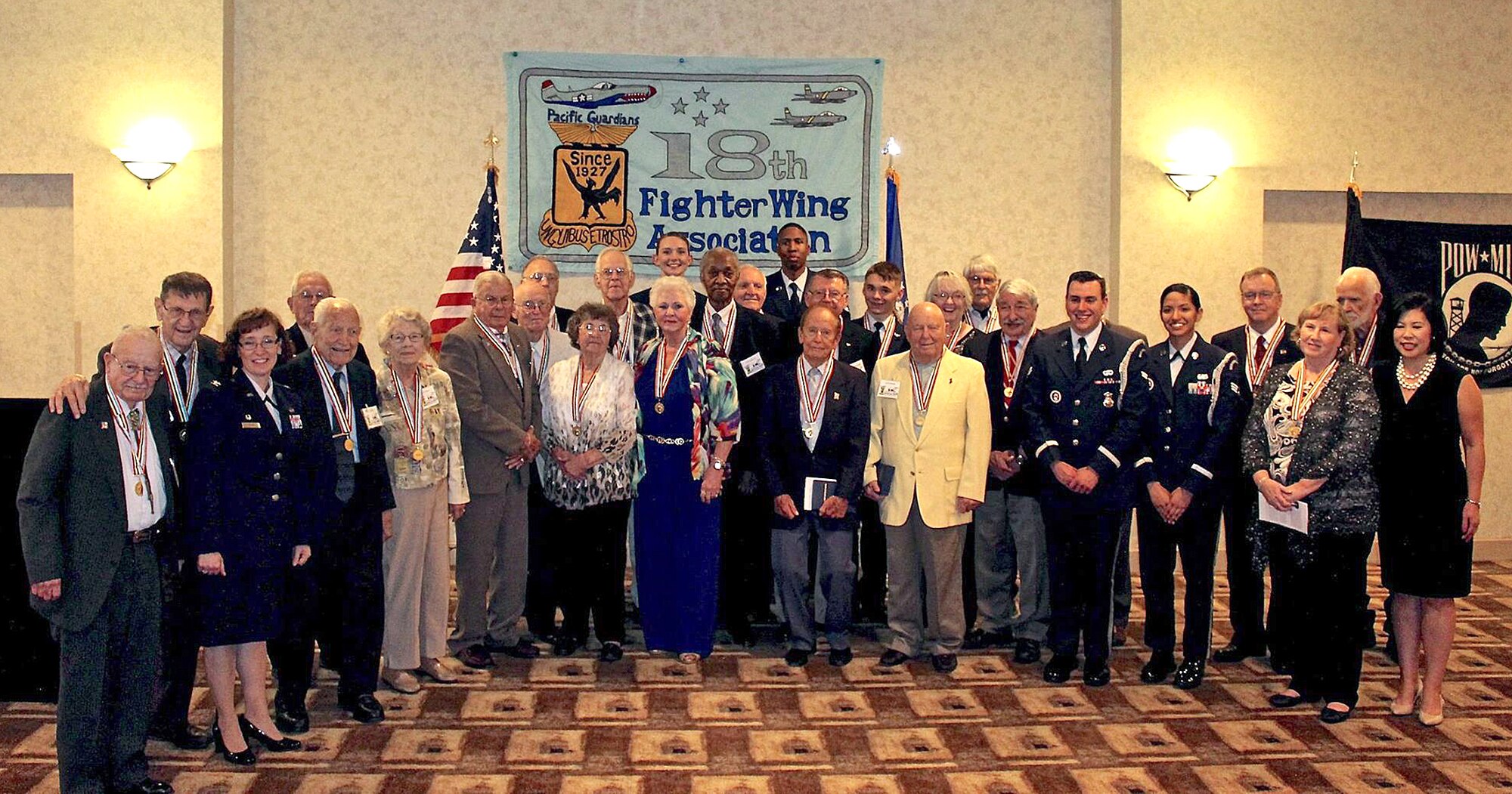 Members from the18th Fighter Bomb Wing Association pose for a photo during their annual reunion dinner Oct. 24, at the Double Tree Hotel San Antonio, Texas. Twenty-five Korean War veterans were honored with the Republic of Korea Ambassador for Peace Medal, a commemorative medal produced by the Korean Government as an expression of gratitude and honor to America's Korean War veterans. (Photo by Susan Kee) (released)